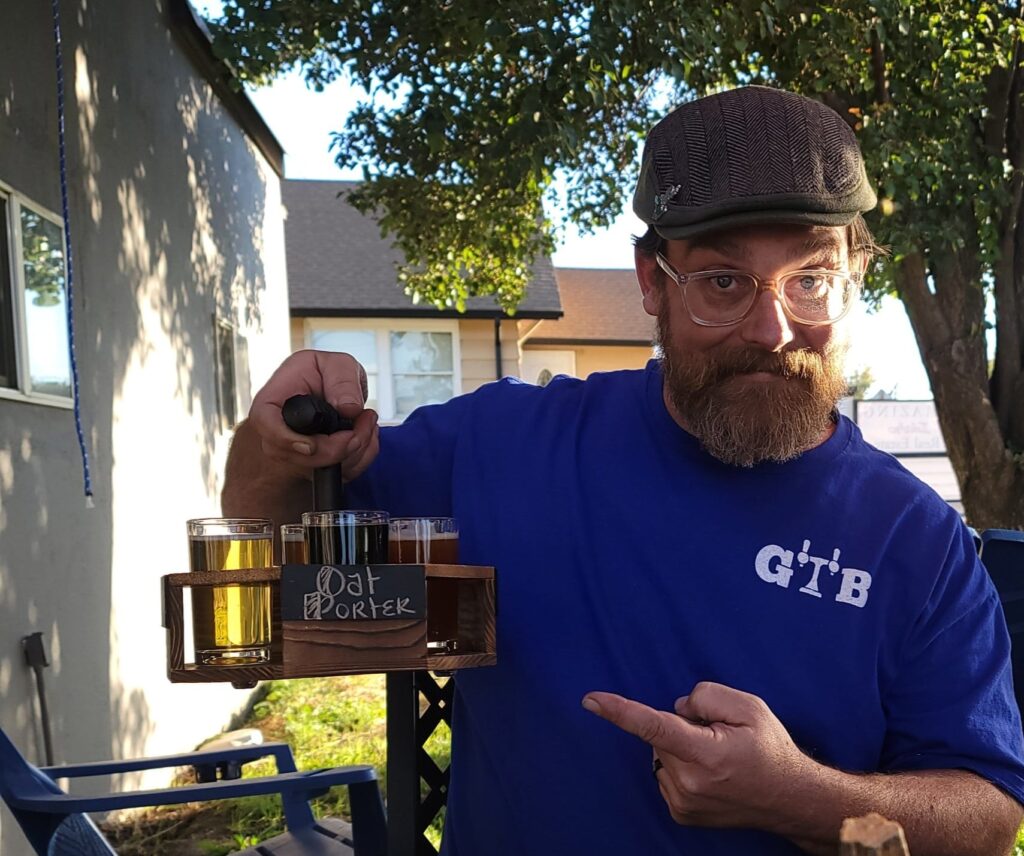 Gerry Turner, owner of Gerald Turner Brewery, holding a flight of beers at Fourth Street Fusion